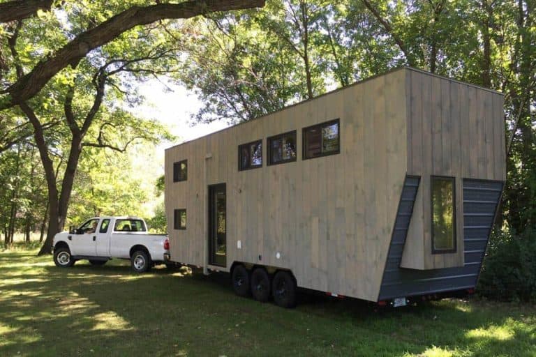Neon Deion downsizes in Tiny House Nation’s most luxurious build ever